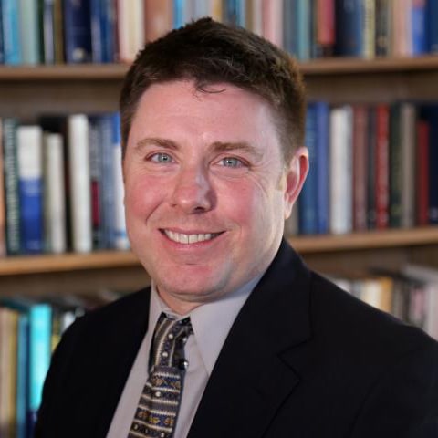 woman sitting at a laptop